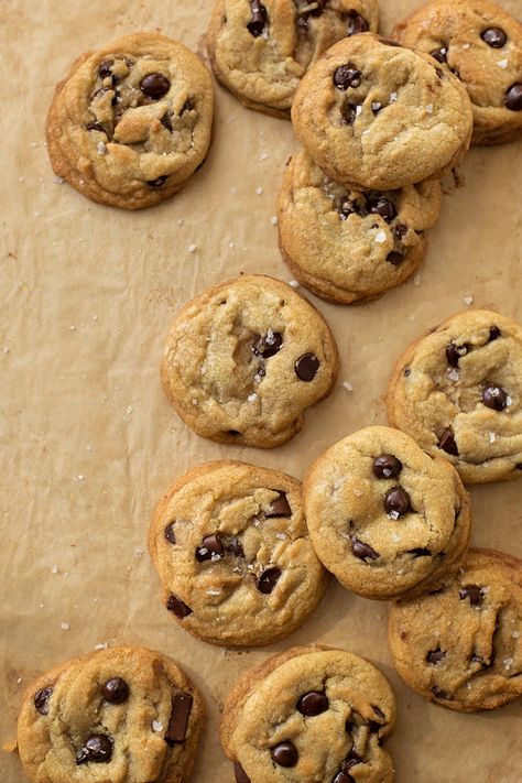 From above view of cookies on a parchment lined baking sheet. Chocolate Chip Cookies Coconut Oil, Cookies Coconut Oil, Dense Cheesecake, Cookies With Coconut Oil, Chocolate Chip Cookies With Coconut, Organic Chocolate Chip Cookies, Oil Biscuits, Oil Chocolate Chip Cookies, Coconut Oil Chocolate Chip Cookies