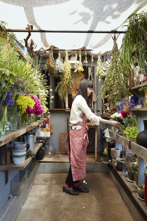 Hidden in a quiet Tokyo alley near the Meiji Shrine's subway station, The Little Shop of Flowers feels a world away from the teeming crowds of the nearby Harajuku and Shibuya districts. Japanese Flower Shop, Japan Flower Shop, Japanese Flower Shop Aesthetic, Korean Florist Shop, Trees With White Bark, Working In A Flower Shop Aesthetic, Storefront Floral Installation, Flowershop Aesthetic Exterior, Flower Shop Interiors