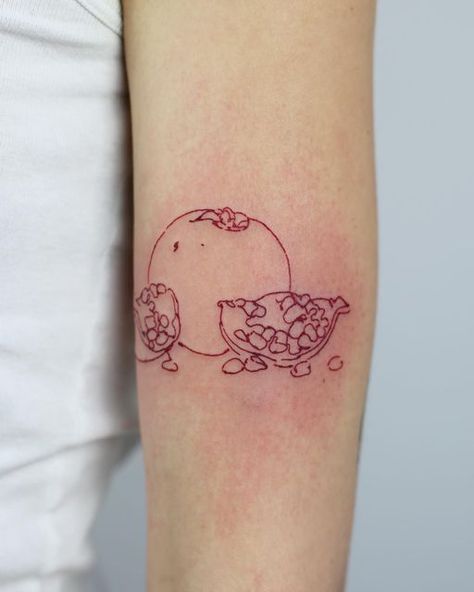 s u k i on Instagram: "Red red pomegranate made at Ottilie recently ! ❤️ Why is there no pomegranate emoji!?" Pomegranate Tattoo Minimalist, Pomegranate Fine Line Tattoo, Pomegranate Tattoo Meaning, Small Pomegranate Tattoo, Pomegranate Tattoo Simple, Pomegranate Stick And Poke, Tiny Pomegranate Tattoo, Red Ink Pomegranate Tattoo, Pomegranate Tattoo