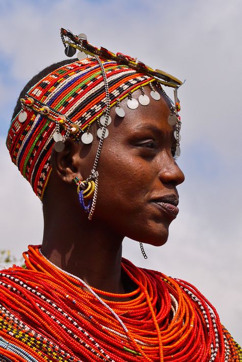 "We passed groups of Rendille heading to the market. These semi-nomadic tribal clansmen and women carried long spears, wearing brilliant red sashes decorated with silvery-coloured braids, ornaments and bangles. Tall and slender, they presented a picture-perfect image of a proud, self-assured independent people." Africa Overland; www.bradtguides.com Afrique Art, Afrikaanse Kunst, African People, Maasai, African Culture, People Of The World, World Cultures, African Beauty, Interesting Faces