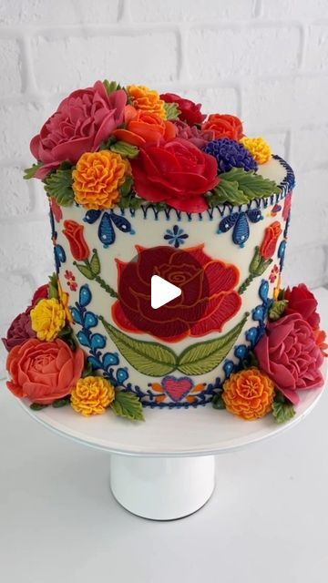 Leslie Vigil on Instagram: "Embroidery cake 🧵🪡 Part TWO🌹 The flower arrangement process  My favorite part!   Here’s some helpful flower arrangement tips:  •Make your flowers in various shapes and sizes! Include flowers, fillers and foliage for balance.   •Make sure your flowers are fully solid. If your finger makes an indent, chill longer.  •Work with a sense of urgency, but don’t panic! If they start to soften, just pop the tray back to the freezer.   •Have a plan, but be flexible. If you accidentally smash or drop a flower, move on to another flower instead.   •Make a few more flowers than you think you might need for the reason above.   •Don’t forget the foliage or some element of green! Shades of green provide the prefect contrast in flower arrangements of any color.  What do you fi Embroidery Cake, Buttercream Cake Designs, Sense Of Urgency, Mexican Embroidery, Green Shades, Cake Inspiration, Move On, My Favorite Part, Flower Arrangement