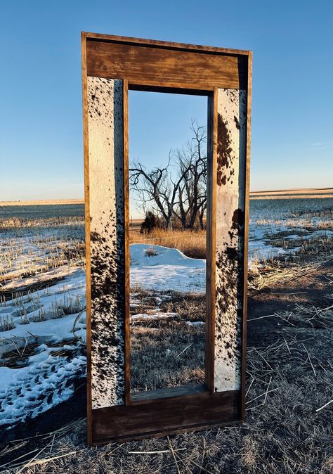 "PLEASE READ PRIOR TO PURCHASE  The perfect western mirror  that everyone needs!  Current production time is 4-6 weeks. If you are needing your order expedited please message us BEFORE you order  Sizing:  Classic full length 55x24.5x2.5 Large full length: 67x28.5x2.5\" Vanity: 44x36x2.5\" Compact Vanity: 38x30x2.5\"  Full Length mirror does not come with hangers as it is designed to be a floor style. Vanity styles comes with two sawtooth hangers. Please send us a message if you're needing some different.  We use REAL cowhide. No two signs will be exactly alike. Please note that being a natural cowhide there could be slight yellowing, or marks.  Need a different size, color, or stain frame? Just send our shop a message and we will get back to you as soon as possible.  Please also note that Western Full Body Mirror, Western Diy Mirror, Western Vanity Desk, Floor Length Mirror Western, Cow Print Mirror Frame, Western Trailer House, Western Full Length Mirror, Western Home Furniture, Cowhide Picture Wall