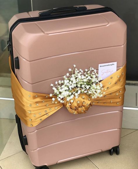 Suitcase wrapped in a gold satin for engagement dowry wrapping. Bridal Luggage Decoration, Suitcase Wrapping Ideas, Luggage Gift Wrapping Ideas, Suitcase Packing For Wedding, Wedding Suitcase Packing, Wedding Suitcase Decor, Luggage Decorating Ideas, Suitcase Decoration Wedding, Suitcase Decor Ideas