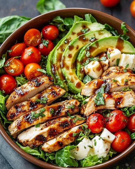 ￼  🍗🥗Grilled Chicken Salad with Balsamic Dressing🍗🥗  Ingredients: Marinade: ¼ cup balsamic vinegar 2 tablespoons olive oil 2 teaspoons brown sugar 1 teaspoon minced garlic 1 teaspoon dried basil 1 teaspoon salt Salad: 4 skinless chicken thigh fillets 5 cups Romaine or cos lettuce leaves, washed and dried 1 avocado, sliced 1 cup cherry or grape tomatoes, sliced ½ cup bocconcini cheese ¼ cup basil leaves, thinly sliced 1 pinch salt, to season 1 pinch pepper, to season Directions: In a small bowl, whisk together the balsamic vinegar, olive oil, brown sugar, minced garlic, dried basil, and salt to make the marinade. Place the chicken thigh fillets in a shallow dish. Pour 4 tablespoons of the marinade over the chicken and toss to coat evenly. Reserve the remaining marinade for use as a dres Chicken Basil Salad, Mince Dishes, Balsamic Salad, Healthy Food Menu, Dried Basil, Healthy Food Inspiration, Balsamic Dressing, Grilled Chicken Salad, Healthy Food Dishes