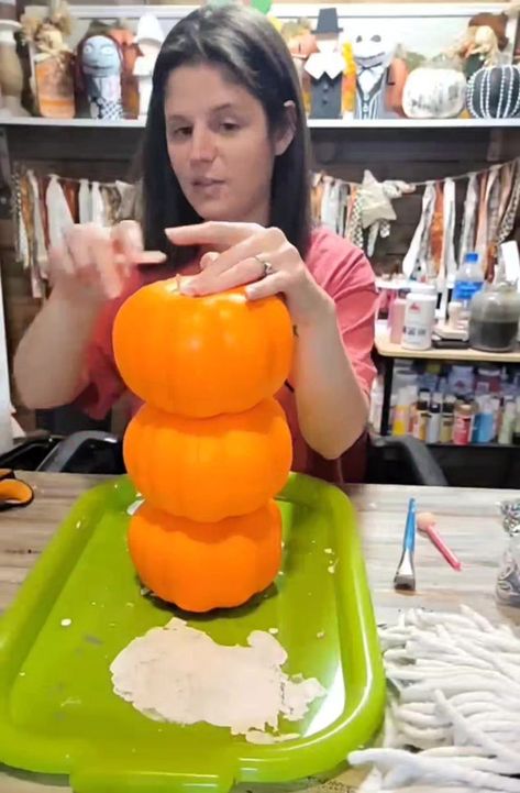 14K views · 112 reactions | Michelle's Shabby Life. | Hey, guys and welcome to Michelle's Chevy Life. In this video, I'm going to show you how I made a snowman out of Dollar Tree pumpkins. First, I glued all the pumpkins together and used the skewer to help hold them together. Then, I painted it white, painted her a cute little apron. I used the buttons on her apron. Then, I used the Dollar Tree mop head for her hair. I drew a cute little snowman face on her. I used the top of the pumpkin for the nose and there you have it. Little snow in. Snowman Out Of Pumpkins, Dollar Tree Pumpkin Snowman, Snowman Made From Pumpkins, Snowman Made From Dollar Tree Pumpkin, Snowman Made Out Of Dollar Tree Stackable Pumpkins, Pumpkin Snowmen, Dollar Tree Pumpkins, Make A Snowman, Snowman Faces