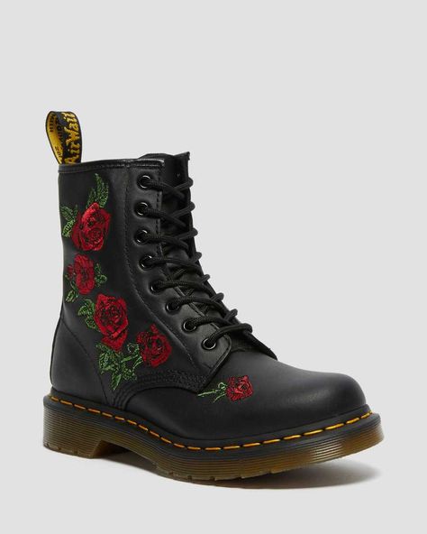 The 1460 was the first Dr. Martens boot — and this one is true to the original, but borrows style from the 14-eye 1914 Vonda, with embroidered roses cascading down the side of the boot. 8-eye boot Retains classic Docs DNA, like grooved edges on its air-cushioned sole, yellow welt stitching and a scripted heel-loop Built on top of the iconic AirWair™ Bouncing Soles Goodyear-welted product Made with Softy T, a lightweight, full-grain leather treated to have a naturally soft and supple feel Shoes Wishlist, Lace Up Boots Women, Dr Shoes, Floral Boots, Yellow Heels, Embroidered Roses, Leather Lace Up Boots, Aesthetic Shoes, Doc Martens