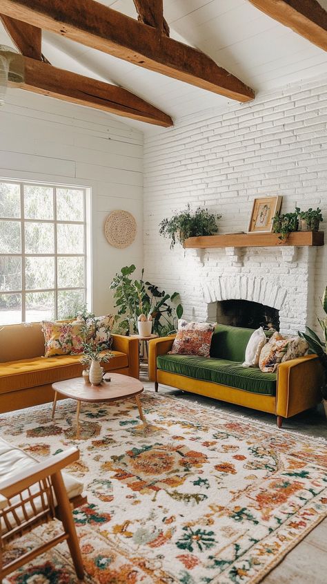 Cozy boho mid-century modern living room with a fireplace, colorful sofas, floral rug, plants, and natural light. Bright Living Room Aesthetic, Light Wood Living Room Ideas, Mid Century Modern Scandinavian Interior, Light Mid Century Modern Living Room, White Couch Mid Century Living Room, Bright Open Living Room, Mid Century Green Living Room, Fireplace White Brick, Boho Living Room Colorful