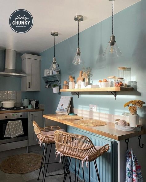 This image shows a kitchen breakfast bar area, the walls have been painted a light blue tone and there is one of our Birtley bracket shelves which has been used for storing kitchen essentials such as jars, egg cups and more! Kitchen Table For Small Kitchen, Terrace Kitchen Ideas, Table For Small Kitchen, Kitchen Table Design, Shelves With Brackets, Chunky Furniture, Decoration Ideas Kitchen, Bracket Shelves, Terrace Kitchen