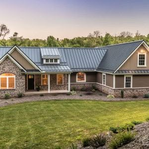 New House with Textured Black ABSeam Roof - A. B. Martin Roofing Supply Black Metal Roof Brick House, Blue Metal Roof, Tin Roof House, Siding Colors For Houses, Black Metal Roof, Metal Roof Houses, Tan House, Metal Roof Colors, Porch House Plans