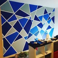 60 Creative DIY Wall Feature Projects Triangle Pattern Wall Blue, Tape Painting Ideas Wall Decor, Blue Triangle Wall Paint, Geometric Wall Paint Blue, Frog Tape Wall Design, Taped Painted Walls Patterns, Triangle Wall Paint, Frog Tape Wall, Geometric Frog