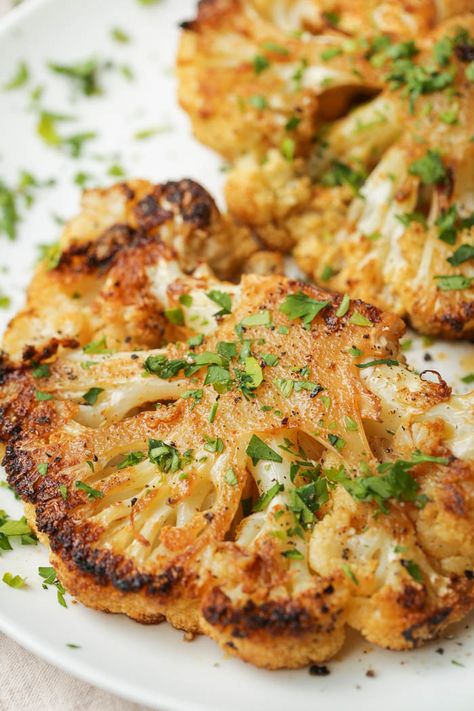 These cauliflower steaks are simply seasoned but absolutely delicious. Tender and packed full of flavor, they are the perfect vegan main course or an easy side dish. #vegan #easy #vegetables #cauliflower Seasoning For Cauliflower, Cauliflower Side Dish Recipes, Cauliflower Steak Recipes, Cauliflower Steaks Roasted, Steaks Recipes, Cauliflower Steaks Recipes, Cauliflower Side Dish, Easy Vegetables, Elimination Diet Recipes