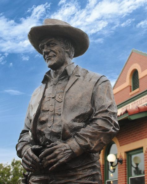 Dodge City, KS, known as "The Original Dodge City," is cowboy country. Old West history comes alive on the streets once walked by Wyatt Earp and Doc Holliday. The Dodge City Trail of Fame, part of the Historic Dodge City Walking Tour includes several larger-than-life bronze statues of legendary Western figures. Sidewalk medallions on the trail pay tribute to movie and television stars who have portrayed notable people of Dodge City. Get into Dodge City! #visitdodgecity #wildwest Dodge City Kansas, Ford County, Male References, Best Summer Vacations, State Of Kansas, Summer Vacation Destinations, Wyatt Earp, Dodge City, Doc Holliday