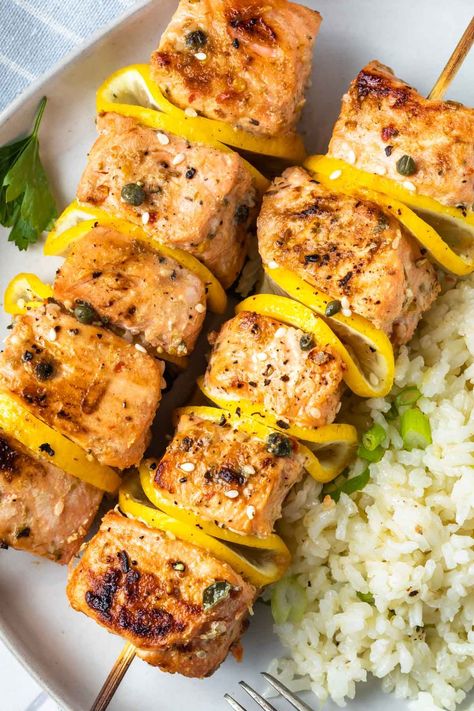 These grilled salmon kabobs are soaked in in a unique marinade blend that’s full of flavor and skewered with lemon. If you can’t cook them on the grill, they can also be baked in the oven. Either way, you’ll get delicious, perfectly seasoned salmon that pairs perfectly with your favorite sides. Simply Whisked, Grilled Salmon Kabobs, Salmon Kabobs, Seasoned Salmon, Salmon Skewers, Coconut Rice Recipe, Salmon Marinade, Vegetable Kabobs, Grilled Chicken Tenders