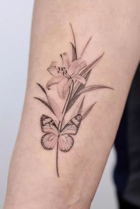 The Meanings Of Lily Tattoos: An Extensive Explanation Butterfly And Lily Tattoo, Lily And Butterfly Tattoo, Lilly Flower Tattoo, Lily Tattoo Meaning, Lily Tattoos, Butterfly With Flowers Tattoo, Butterfly Tattoo Stencil, Lillies Tattoo, About Butterfly