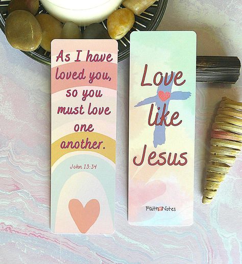 "Love like Jesus" is the simple but powerful message on this colorful and unique bookmark.  This double sided bookmark is professionally printed on premium card stock with Bible verse John 13:34 on the glossy front side and the important call to "Love like Jesus" on the silk finish back side.  For added flair, this bookmark can be ordered with a matching handmade beaded tassel.  Bookmarks are a great gift for any occasion that can be used over and over again.  You can also keep this great bible bookmark to use with your own prayer journal, bible study guide, pregnancy journal, or any old book between your bookends.  Lamination is also an available option. Specifics ~ Double-Sided 2 x 6 bookmark with rounded corners (laminate option slightly larger) ~ Original graphic design on each side of Bookmarks Handmade Bible Verse, Bible Verses Bookmark, Bible Bookmarks Diy Scriptures, Bookmark For Bible, Bible Book Mark Ideas, Bible Verse Crafts, Bible Bookmarks, Short Bible Verses, John 13 34