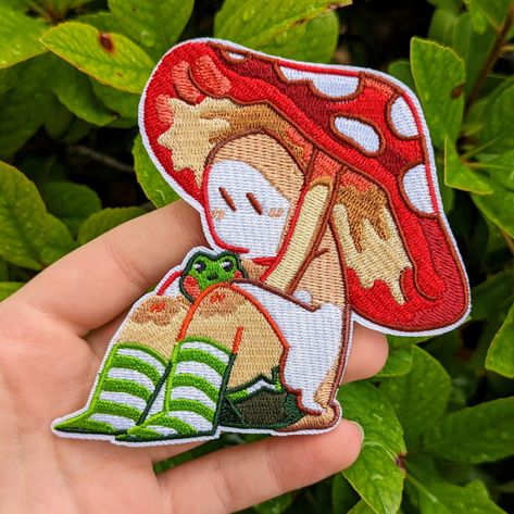 "❤ RED MUSHROOM GHOST PATCH ❤ ♡ This cute lil ghostie with pet frog is perfect for livening up your denim jacket, jeans, backpack, purse, and more! ♡ This patch is an Iron on patch ♡ Art is made by me :) ♡ Sizes: - 4.25x4\" ♡ Materials: - Embroidered Patch ♡ SHIPPING & RETURNS ♡ - Please allow 1-4 business days for processing and shipping your order! - This item will be shipped in a cardboard mailer without tracking to minimize your costs. - No returns or exchanges will be accepted and I am not Mushroom Jacket, Ghost Clothes, Mushroom Ghost, Pet Frog, Jacket Patches, Pet Frogs, Jeans Backpack, Pin Ideas, Red Mushroom