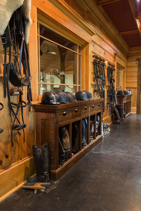 Tack rooms should be both beautiful and functional, so keep these design ideas in mind. Include a large island with baskets, bins, and hooks that make it easy to access your equipment. Incorporate shelves with hooks to store and retrieve boots. And maximize wall space with a variety of cleaning racks for cleaning your saddle and other tack items. Horse Tack Room Ideas, Tack Room Ideas, Shelves With Hooks, Horse Tack Rooms, Horse Farm Ideas, Tack Rooms, Barn Builders, Building Company, Dream Barn