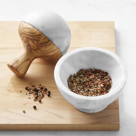 Designed to crush instead of chop, mortars and pestles help maximize the flavor of herbs, seeds and spices. Our exclusive set is expertly handcrafted in Italy using premium marble and sustainably sourced olivewood. Featuring a comfortable handle, the pestle has a half-round shape that promotes quick, efficient grinding. Set includes mortar and pestle. Expertly handcrafted of premium marble and sustainably sourced olivewood. Natural variations in color and pattern of stone and wood make each piec Sweet Kitchen, New Kitchen Gadgets, Mortar Pestle, Table Setting Inspiration, Platter Set, Dining Table Decor, Mortar And Pestle, Williams Sonoma, Cookbook Recipes