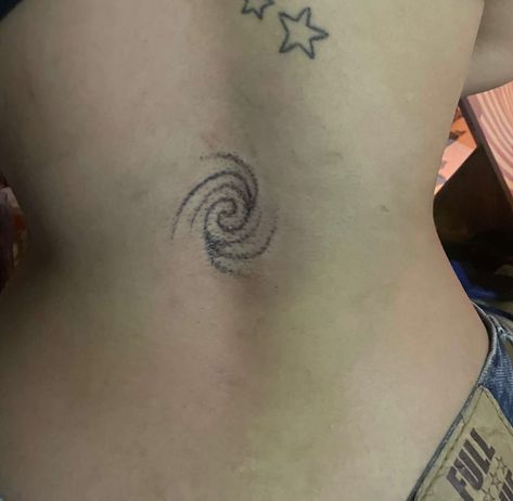 star tattoo, back tattoo, Spiral Tattoo On Shoulder, Spiral Back Tattoo, Swirl Tattoo Spirals, Spiral Shell Tattoo, Stars Back Tattoo, Unique Lower Back Tattoos, Red Tramp Stamp, Symmetrical Chest Tattoo, Stippled Tattoo