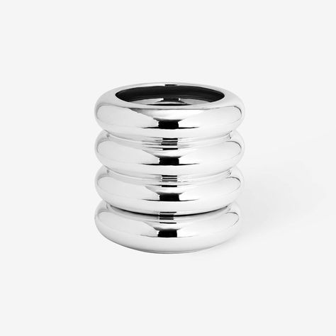 The Stacking Planter discretely integrates both a planter and saucer into one form. Lift out the bottom ring to reveal a hidden saucer. The circular form takes its inspiration from high voltage ceramic insulators found on power lines. This Stacking Planter is a limited artist series, featuring the designers' signature on the bottom. Features Stacking Collection Available in Chrome finish Areaware Stacking Chrome Planter in Silver Creative Wall Design, Kids Room Lighting, Power Lines, Outdoor Table Lamps, Pop Bottles, Maisie Williams, Modern Lamp, Burke Decor, High Voltage