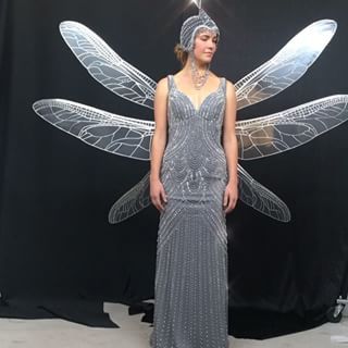 #tbt to our first fitting S2 with our #beatrice #dragonfly costume on #asoue @unfortunate @netflixasoue #lemonysnicket This is actually Beatrice’s photo double, and at the end of the day we only saw this costume in silhouette when #countolaf pushes her off the balcony edge at the #vfd HQ. So gorgeous...such amazing work by all! Wings are lazer cut #aluminium and affixed to body with plates and a bodysuit! Very lightweight. keep your #eyes 👁👁peeled in S3...where the wings make several appearanc Beetle Wing Dress, Wings Wearable, Wings Fashion Show, Beetlejuice Sophia Anne Caruso, Emily Wilde's Encyclopaedia Of Fairies Aesthetic, Count Olaf, A Series Of Unfortunate Events Netflix, Lazer Cut, Lemony Snicket