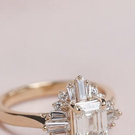 The Engagement Specialists on Instagram: "We are swooning over this custom designed ballerina art deco style engagement ring we helped Grant design for his love, Maribeth. Featuring an Emerald shape diamond center stone and a gorgeous surrounding halo of baguette and round shape diamonds, this ring gives all the gatsby vibes.

#artdecorings #artdecostyle #customengagementring  #gatsbyvibes #engagementring #vintagevibes #gemhuntrings #vintagebride #ringgoals #showmeyourrings #ringenvy #jewelsofinstagram #theknotrings #ringinspiration #alternativebride #ringsofinstagram #vintagestyle #ballerinaring  #neworleansvintage #bridalinspiration #pursuepretty #thedailywedding #vintageweddingstyle #emeralddiamondring #vintageweddings" Gatsby Vibes, Ballerina Ring, Gem Hunt, Ballerina Art, Alternative Bride, Emerald Diamond Ring, Vintage Style Wedding, Vintage Bride, Bridal Inspiration