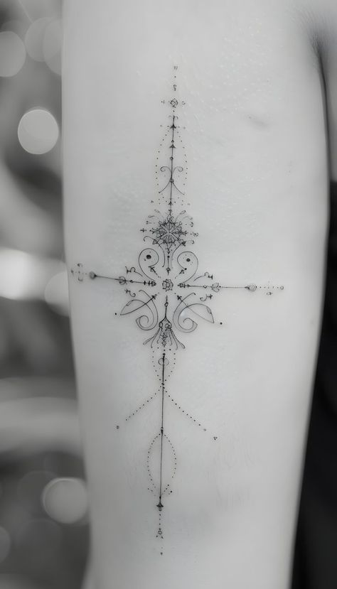 This simple yet elegant cross tattoo uses fine linework, perfect for women who prefer a minimalist design on their upper arm. Its clean look gives it a timeless appeal. Tattoo Ideas For Women Arm, Minimalist Cross Tattoo, Dainty Cross Tattoos For Women, Tricep Tattoos Women, Cross Tattoo Ideas, Tricep Tattoos, Simple Cross Tattoo, Cross Tattoos For Women, Simple Cross