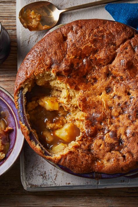 A round apple cake-style dessert with toffee apples shown underneath a scoop taken out. Eves Pudding, Sticky Pudding, Self Saucing Pudding, Butterscotch Pudding, Gratin Dish, Toffee Apple, Dessert Aux Fruits, Bbc Food, Winter Desserts