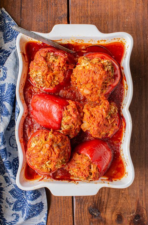 This Stuffed Peppers Recipe is a classic on our dinner table! Sweet bell peppers are stuffed with, ground beef, rice, and tomato sauce! Easy stuffed peppers couldn't be simpler! Sauce For Stuffed Peppers, Recipe With Tomato Soup, Rice And Tomato Sauce, Stuffed Bell Peppers Ground Beef, Best Stuffed Pepper Recipe, Sweet Pepper Recipes, Stuffed Peppers With Rice, Ground Beef Rice, Easy Stuffed Peppers