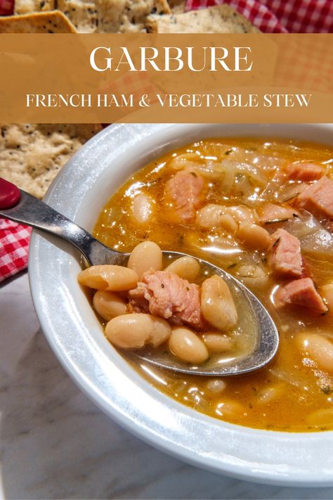 Garbure is a hearty French ham hock and vegetable stew or soup incorporating a blend of various vegetables and often includes beans or cabbage. It is a flexible recipe and can be varied based on what you have in your kitchen. #RecipeMash #French #Soup #Stew #Ham Recipes With Ham Broth, Vegetable Stew Recipe, French Soup, Ham Hock, Ham And Beans, Single Serving Recipes, Ham And Bean Soup, Vegetable Stew, Winter Soups