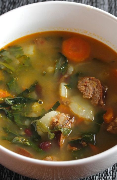 Kale simmers with sausage, garlic, onions and more for the Best Portuguese Kale Soup recipe. #soup #kale Portuguese Kale Soup, Sausage Beans, Portuguese Soup, Kale Sausage, Potatoes Healthy, Kale Soup Recipes, Kale Soup, Kale Recipes, Soup And Stew