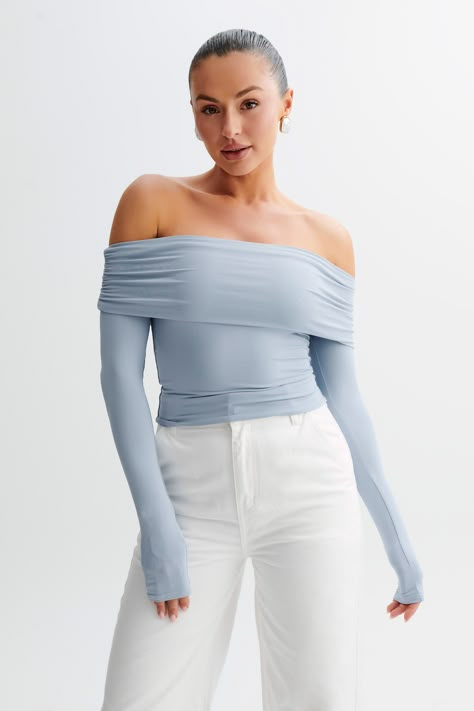 The cool shoulder.   LUCINDA is a long-sleeved off-shoulder top with a ruched neckline and a slightly cropped torso. Cut from comfortable, preferred fibres, it has a semi-bodycon fit that hugs and flatters your curves. A modest piece with a modern design, this top is fresh and versatile. Blue Off Shoulder Top, Off The Shoulder Top Outfit, Every Day Outfits, Capsule Wardrobe Basics, Light Blue Top, Dresses Date Night, Black Dress Prom, Maxi Dress Sale, Trendy Outfits For Teens