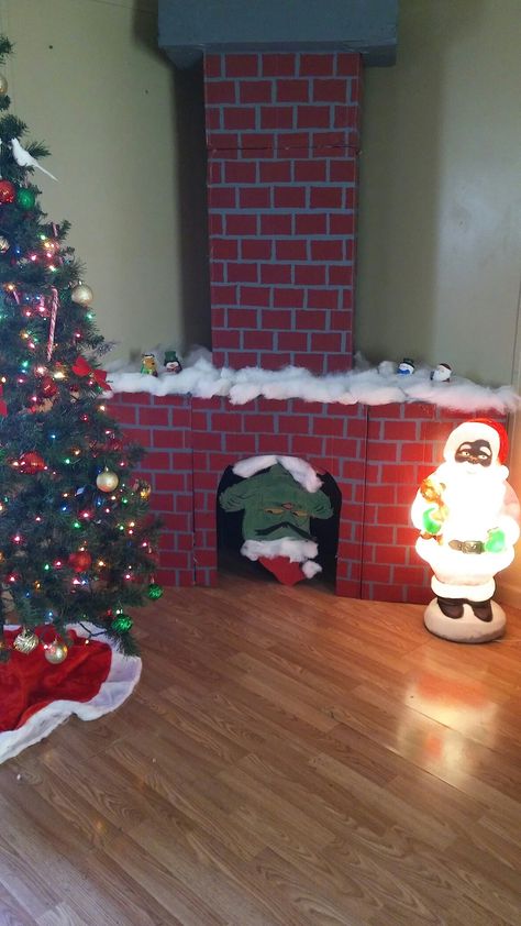 Faux cardboard fireplace with chimney and the grinch diy christmas Diy Christmas Fireplace, Diy Christmas Door Decorations, Cardboard Fireplace, Classroom Christmas Decorations, Diy Christmas Door, Grinch Christmas Decorations, Christmas Fireplace Decor, Diy Christmas Decorations, Diy Christmas Decorations Easy