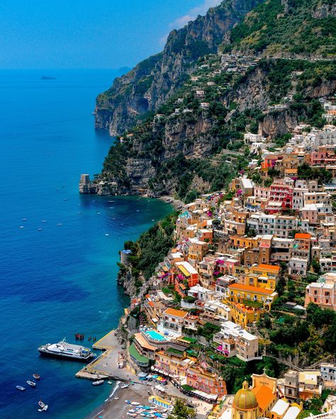 "When in Positano, which is located along the Amalfi Coast of Italy, you will be very tempted to spend your entire time meandering along the beach, the storefronts and restaurants. And why not, it is such a beautiful town that you just can't get enough of it.  While I do agree and can confirm that we did spend plenty of time in the core of the town, I wanted to see more and from a different perspective, I wanted to go high up.   With our hiking boots on, we began our trek to get to top of the mountain range that cradles the town.  The hike took a while but the visuals along the hike were fantastic.  With every new elevation and turn, there was a new vista to enjoy.  When we reached about halfway up the mountain, we came upon this location from where I witnessed this view, it was very speci