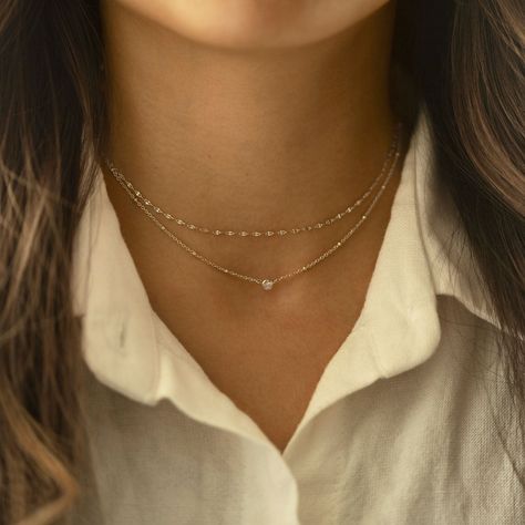 This elegant choker from our signature O Collection is great to pair with other necklaces from this collection. Our patented connectors let you easily link and layer necklaces in any order you desire. Learn more Chain Thickness 1.5mm Cubic Zirconia Diameter: 0.2in (5mm) Adjustable chain: 15-18in (38-45cm) .925 Sterling Silver Spring clasp closure Hypoallergenic, lead and nickel free #040S Layer Necklaces, Necklaces Unique, Elegant Choker, Layered Choker Necklace, Silver Necklace Set, Silver Choker Necklace, Layered Chokers, Fancy Necklace, Necklace Sets