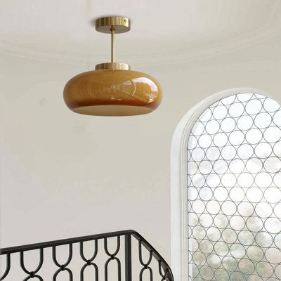 This 1-light ceiling pendant lamp adds a warm light to your kitchen island, dining table, or entryway. The dome's caramel-colored glass lamp shade can be well decorated whether the light is turned on or off, and the copper ceiling plate and metal copper rod make it look more sophisticated and stylish. Size: 5.9" H x 11.02" W x 11.02" D | Mercer41 Meighan 1 - Light Copper Dome Pendant Glass / Metal in Brown / Orange / Yellow | 5.9 H x 11.02 W x 11.02 D in | Wayfair Midcentury Pendant Lights, Vintage Copper Decor, Kitchen Lighting Fixtures Over Sink, Eclectic Light Fixtures, Island Dining Table, Kitchen Island Dining Table, Copper Rod, Copper Ceiling, Kitchen Island Dining