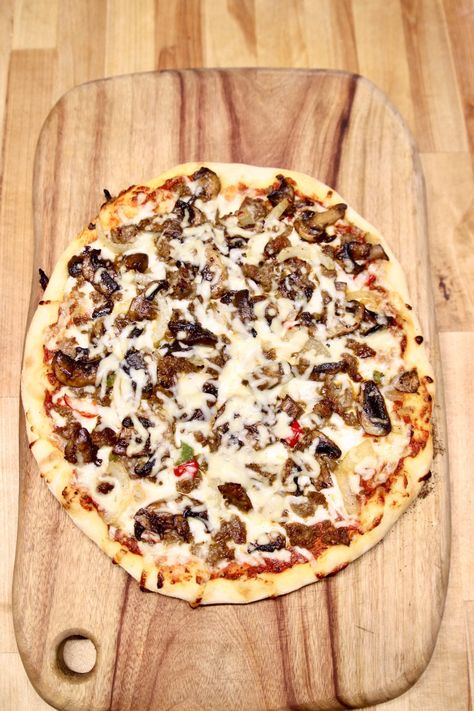 Grilled Sausage Mushroom Pizza is a super easy weeknight dinner that will rival your favorite take-out pizza restaurant. Homemade dough topped with Italian sausage, sautéed mushrooms, peppers, onions and plenty of cheese. Sausage And Mushroom Pizza, Sausage Pizza Recipe, Italian Sausage Pizza, Dinner For Family, Mushroom Pizza Recipes, Homemade Pizza Recipe Easy, Sausage Mushroom, Delicious Pizza Recipes, Fennel Sausage