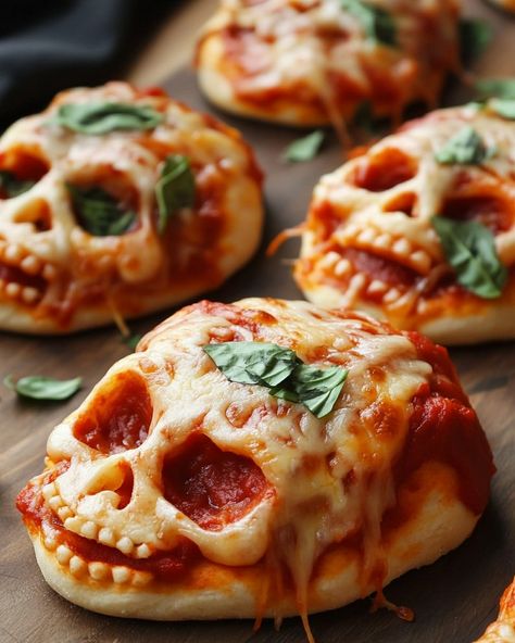 🧛‍♂️ Halloween Pizza Skulls 🧛‍♂️ Ingredients: - 1 can refrigerated pizza dough - 1/2 cup pizza sauce - 1 cup shredded mozzarella cheese - 1/2 cup pepperoni slices, chopped - 1/4 cup black olives, sliced (for decoration) - 1/2 teaspoon dried oregano - 1/2 teaspoon garlic powder Instructions: 1. Preheat your oven to 375°F (190°C). Grease a skull-shaped baking pan or line a regular baking sheet with parchment paper. 2. Roll out the pizza dough on a floured surface to about 1/4 inch thickness... Halloween Pizza Skulls, Pizza Skulls, Friday Night Pizza, Sweet Chili Sauce Recipe, Halloween Pizza, Refrigerated Pizza Dough, Spooky Snacks, Halloween Party Snacks, Fun Halloween Food