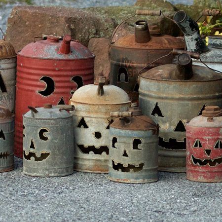 Vintage antique gas cans with jack-o-lantern faces cut into each by Tish, Mike and Ian Bachleda. Selection varies. Gas Can Jack O Lantern Diy, Oil Can Jack O Lantern, Metal Gas Can Ideas, Pumpkin Gas Cans, Oil Can Pumpkins, Gas Can Pumpkins Diy, Pumpkins Made From Tin Cans, Old Metal Gas Can Ideas, Gas Can Jack O Lantern