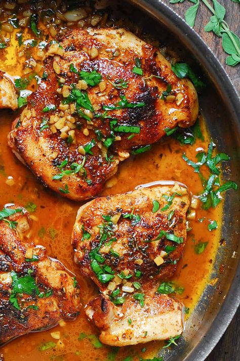 cajun chicken with garlic lemon butter sauce in a stainless steel pan. Cajun Marinated Chicken, Cajun Chicken Bake, Cajun Butter Chicken Thighs, Cajun Chicken Thigh Recipes, Cajun Chicken Marinade, Cajun Honey Chicken, Cajun Chicken Bites, Cajun Chicken Thighs, Lemon Garlic Butter Chicken Thighs