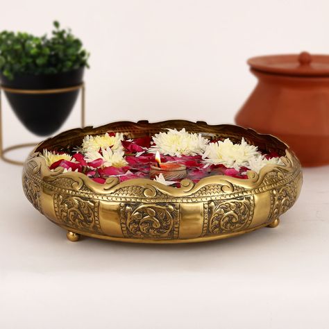 Want to hear how you can easily decorate any table, entrance or temple? Get a brass urli and place rose petals (or any flower of your choice), candles and water to soften your ambience. Brass Urli, Diwali Decorations At Home, Living Room Tv Cabinet, Pooja Items, Goddess Decor, Beautiful Rangoli, Beautiful Rangoli Designs, Metal Candle Holders, Pooja Rooms