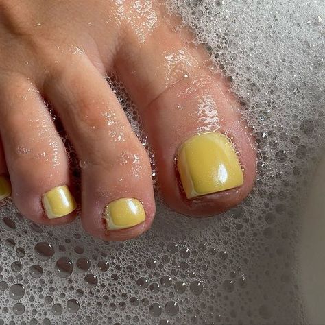 This nail art features a calming pastel yellow hue, creating a gentle and pristine aesthetic, ideal for unwinding at home or indulging in a spa retreat. The polish is meticulously applied, yielding a refined and understated charm that accentuates the innate grace of the nails, catering to those with a penchant for subtle sophistication. Yellow Toe Nail Designs, Neon French Tips, Yellow Toe Nails, Cobalt Blue Nails, Yellow Chrome, Nails Making, Summer Nails Colors Designs, Nail Base Coat, Green Nail Art