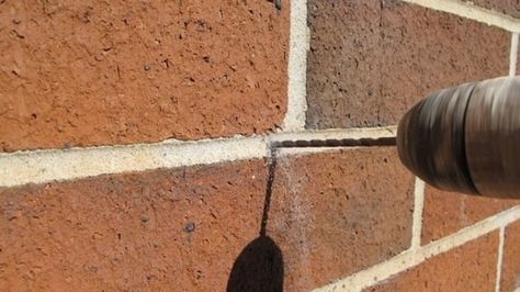 A CONTRACTOR'S TRICKS TO HANGING ITEMS ON BRICK MORTAR JOINTS AND HOW TO PATCH AFTERWARDS. Hang Garland Around Door, Garland Around Door, Building Hacks, Adirondack Furniture, Wall Hangers, Cottage In The Woods, Hanging Garland, How To Hang, House Projects