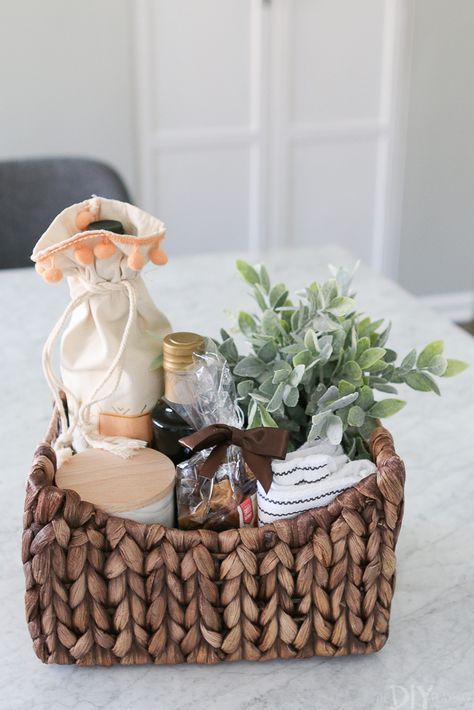 Create this adorable and simple #housewarming gift for new homeowners. Buy a basket and fill it with wine, olive oil, new towels, and all kinds of pretty items. #giftidea #newhomeowner Pretty Items, Cake Flower, Gift Wrapping Ideas, Wine Gift Baskets, Wine Baskets, Diy Gift Baskets, Creative Diy Gifts, New Homeowner Gift