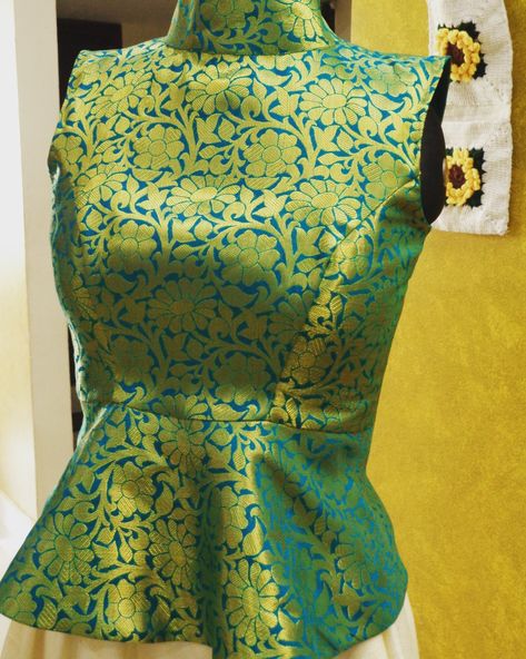 Green brocade peplum crop top with standing collar Brocade Peplum Top, Brocade Crop Top Designs, Brocade Top Designs, Stand Collar Blouse Indian, Brocade Crop Top, Long Blouse Designs, Stand Collar Blouse, Blouse Tops Designs, Model Blouse