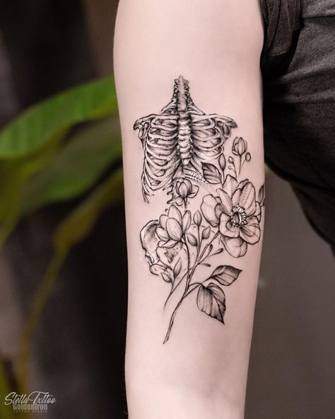 Bones & floral 🌌 ———————————— #goldenirontattoostudio #tattoo #skeletontattoo #inkedgirls #floraltattoo #flowertattoo #torontotattoo… Flowers Growing From Skeleton Tattoo, Rib Cage And Flowers Tattoo, Ribcage With Flowers Tattoo, Bones And Floral Tattoo, Half Skeleton Half Flower Tattoo, Botanical Skeleton Tattoo, Floral Skeleton Tattoos For Women, Floral Bone Tattoo, Anatomical Ribcage Tattoo