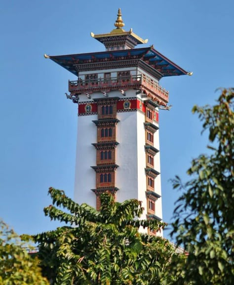 History repeats itself after more than 700 years as the tower of Sekhar Gutok (sras mkhar dgu thog), “the nine storied son’s castle” built by Milarepa in Lhodrak, Tibet, is being built in Bhutan. Tourism Council of Bhutan Rammed Earth Homes, Bhutan Travel, Mountain Architecture, Japanese Mountains, Unusual Buildings, Travel Oklahoma, Landlocked Country, Temple Architecture, Buddha Art