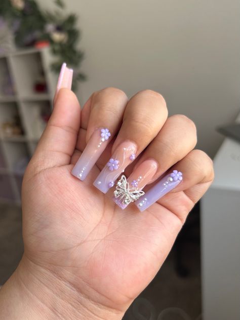 Long Acrylic Nails With Butterfly Charms, Purple Nail With Butterfly, Purple With Butterflies Nails, Lavender Nails With Pearls, Lilac Nails Medium Length, Purple And Silver Butterfly Nails, Butterfly Nail Charm Nails, Purple Butterfly Nails Almond, Lilac Nails With Gems