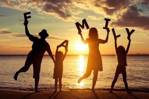 Happy family standing on the beach. | High-Quality People Images ~ Creative Market Happy Family Images, Mehendi Photography, What Is Family, Wedding Photography Bridal Party, Wedding Photography Checklist, Outdoor Family Photography, Summer Poses, Muslim Couple Photography, Wedding Photography Bride