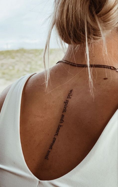 Spine Tattoos For Women Lyrics, Female Spine Tattoos Quotes, Wording Spine Tattoo, Woman Spine Tattoo Ideas, This Too Shall Pass Quote Tattoo Spine, Script Tattoo Spine, Sister Spine Tattoos, Bible Spine Tattoos For Women, Boho Spine Tattoo